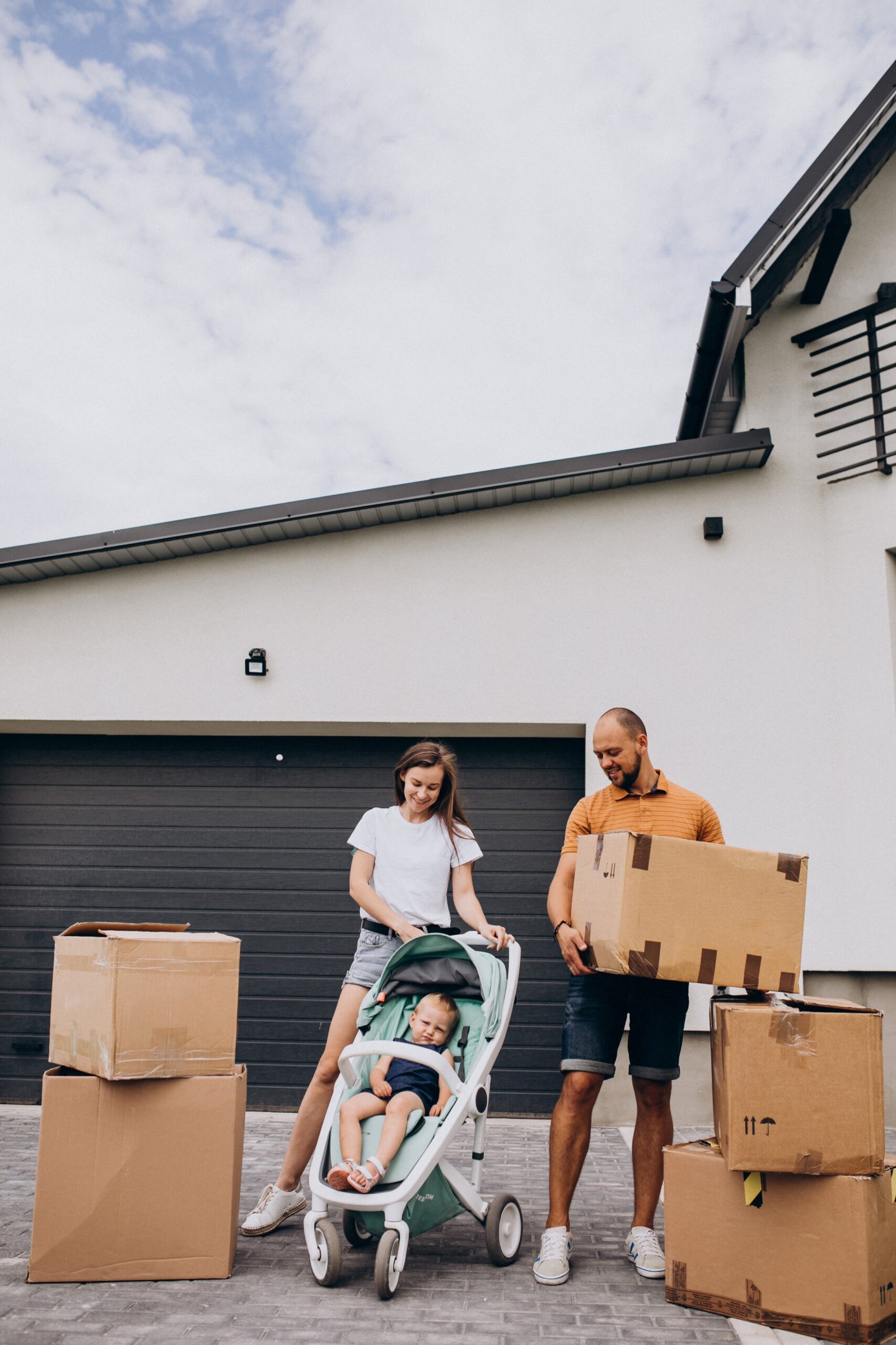 young family with little daughter moving into new house